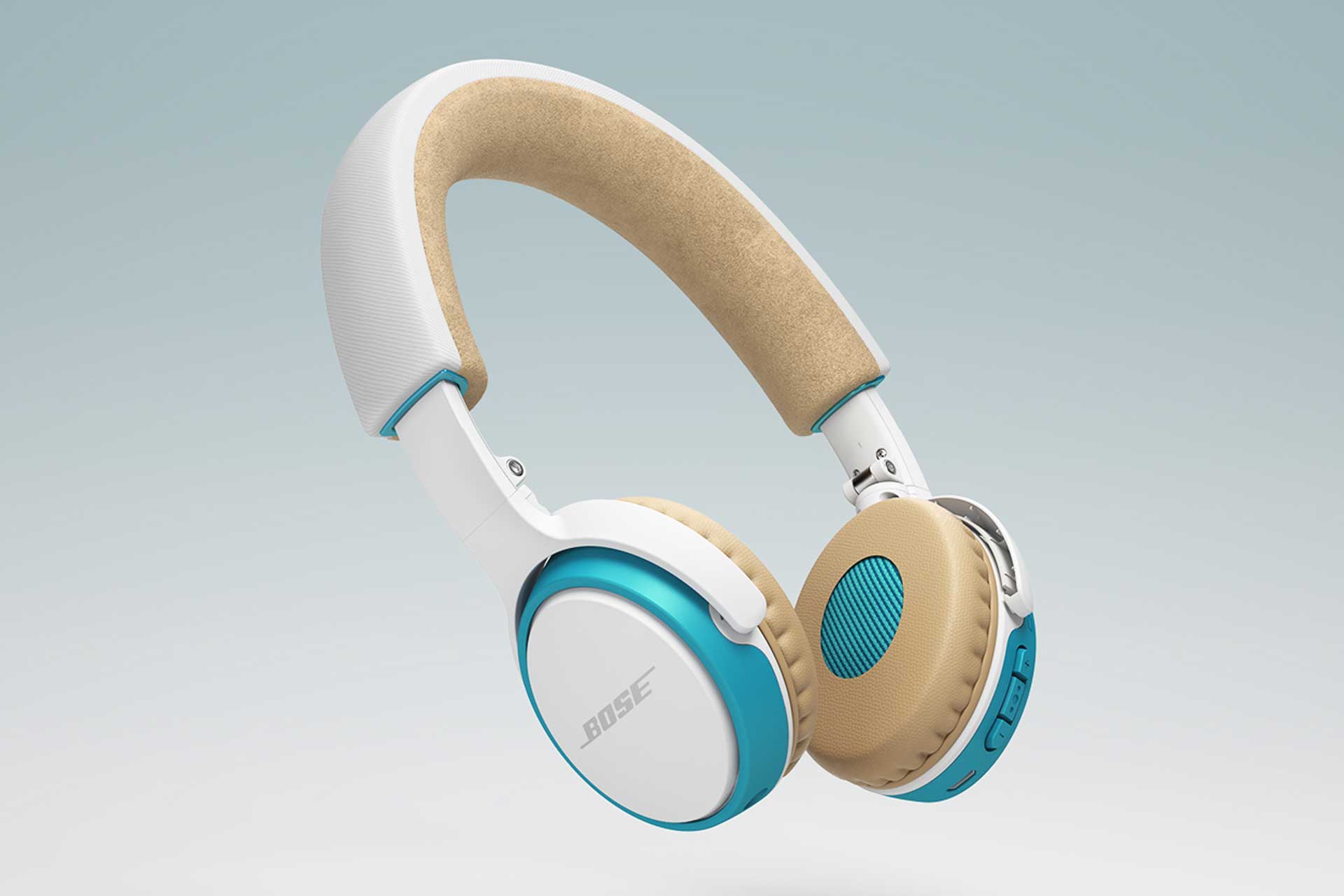 Side view image of blue, white, and tan BOSE wireless headphones