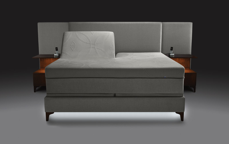 Adjustable smart bed against a gray background